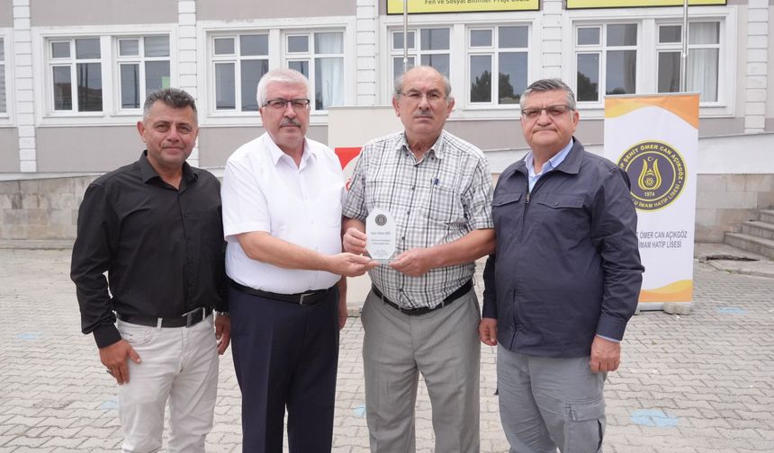 OSMAN AKSU’YA ANLAMLI PLAKET